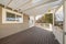 Terrace of a house with sliding windows and arched doorframe