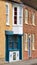 Terrace  Housing and Colourful Tiled Butchers Shop Front