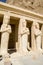 Terrace pillars with engaged Osiride statues of Hatshepsut in Mortuary Hatshepsut Temple, Luxor