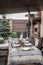 Terrace with served table for family dinner with elegance gas patio heater, outdoor cafe appliance