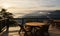 Terrace tranquility, 3D rendering of wooden tables, chairs, misty mountain