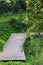 Terrace wooden platform. A wooden platform in the park. Decking wood path