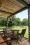 Terrace with wooden table and chairs