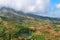 Terraced fields under white clouds