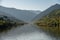 Terraced vineyard on the banks of the Douro river entering narrow gorge