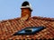 Terracotta chimney and roof detail with roof skylight
