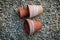 Terracotta clay flower pots on a rolled gravel background