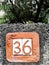 A terracotta house number
