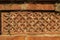 Terracotta patterns ancient stone carving, pattern on the stone wall of Bagha Shahi Mosque