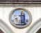 Terracotta relief of a Franciscan saint by Andrea della Robbia in a spandrel of the Hospital of San Paolo in Florence, Italy.