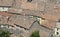 Terracotta tiled roofs nearby in crowded village with many house