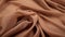 Terracotta Waves: A Detailed Close-up Of Tan Silk Material