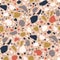 Terrazzo seamless pattern with colorful chips, fractions or fragments scattered on light background. Modern decorative