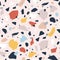 Terrazzo seamless pattern with colorful rock pieces. Abstract backdrop with stone sprinkles scattered on light