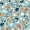 Terrazzo seamless pattern with colorful stone fractions. Natural backdrop with mineral splinters scattered on blue