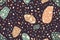 Terrazzo trendy vector seamless pattern. Granite fragments creative backdrop. Chaotic mosaic pieces on black background