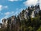 Terrible lifeless rocks, a glacier in the Alps, clouds and fog spread over the peaks of the mountains