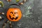 Terrible sweets worms for Halloween in decorative pumpkin on a