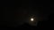 Terrific timelapse. Moon descend over black murk mountain summit. Dark night sky