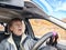 Terrified female driver a second before the accident. Scared middle-aged adult woman holds the steering wheel of a car