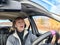 Terrified female driver a second before the accident. Scared middle-aged adult woman holds the steering wheel of a car