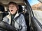 Terrified female driver a second before the accident. Scared middle-aged adult woman holds the steering wheel of a car