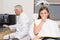 Terrified little girl looking at camera in dentists chair