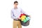 Terrified young man holding a laundry basket