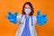 The terrifying look of a doctor with aggressively outstretched hands. A nurse in a white coat and protective mask stretches her