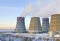 Territory of heat and power station. Accumulator tanks and cooling towers. Close-up. Winter