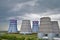 Territory of heat and power station. Accumulator tanks, cooling towers and the sky before the storm. Close-up