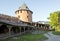 territory inside the Kremlin of Veliky Novgorod, Russia, terracotta round tower with Windows, the medieval fortress, the path , b