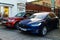 Tesla Electric vehicle and Range Rover Sport side by side parked in Coventry Street