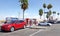 Tesla vehicles charging at super charging station next to gas station