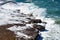 Tessellated rock platform weathered by ocean waves