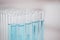 Test tube, blue chemical and closeup, chemistry and science study in lab, sample and medical research. Pharmaceutical