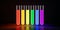 Test tubes with glowing fluids in lgbt rainbow colors isolated on black background. Concept of research in lgbt field