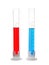 Test tubes with red and blue liquids on white background