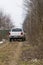 Testing a 4x4 jeep car at the edge of a forest 