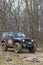 Testing a 4x4 jeep car at the edge of a forest 