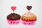 Testy muffins on white background for Valentine\'s day. Selective