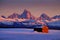 Tetons Mountains Sunset in Winter with Old Cabin Homestead Building