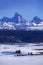 Tetons Mountains in Winter with Old Cabin Homestead Building