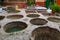 TETOUAN, MOROCCO - MAY 24, 2017: Different stone vats with dye for leather at Tannery of Tetouan Medina. Northern Morocco