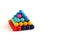 Tetragonal pyramid of multi-colored puzzle elements in the form of balls,  isolated