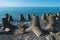 Tetrapod breakwaters on the coast. concrete breakwaters of tetrapods lie all along the coast.