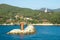 Tetrapods breakwater with red beacon located in DSME bay with the view of Admiral Yi Sun-Sin`s monument at Okpo