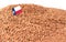 Texas flag sticking in buckwheat grain. The concept of export and import of buckwheat