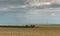 Texas landscape with rows of hay bales ready for transport