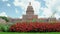 Texas State Capitol in Austin, Texas on a sunny summer day with colorful flowers in the front yard